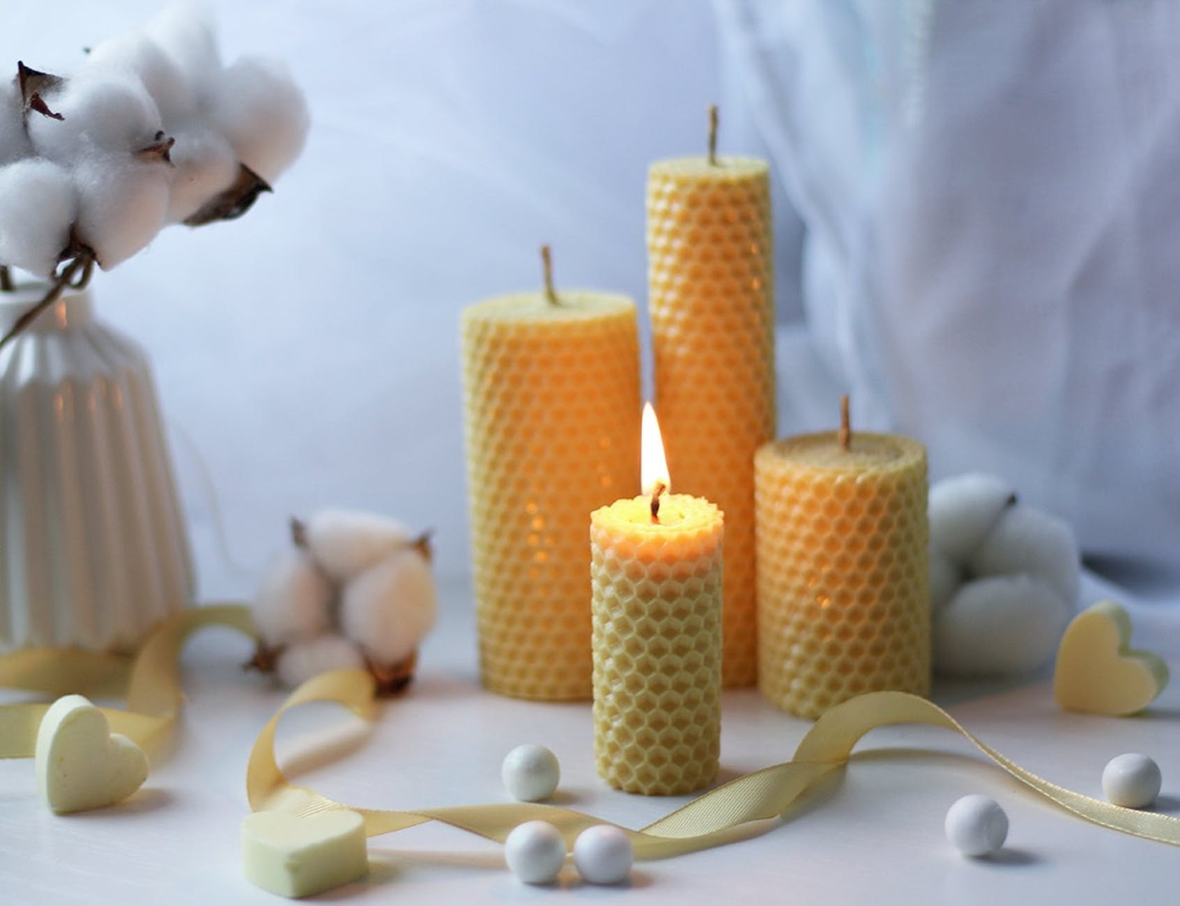 white candles on white table