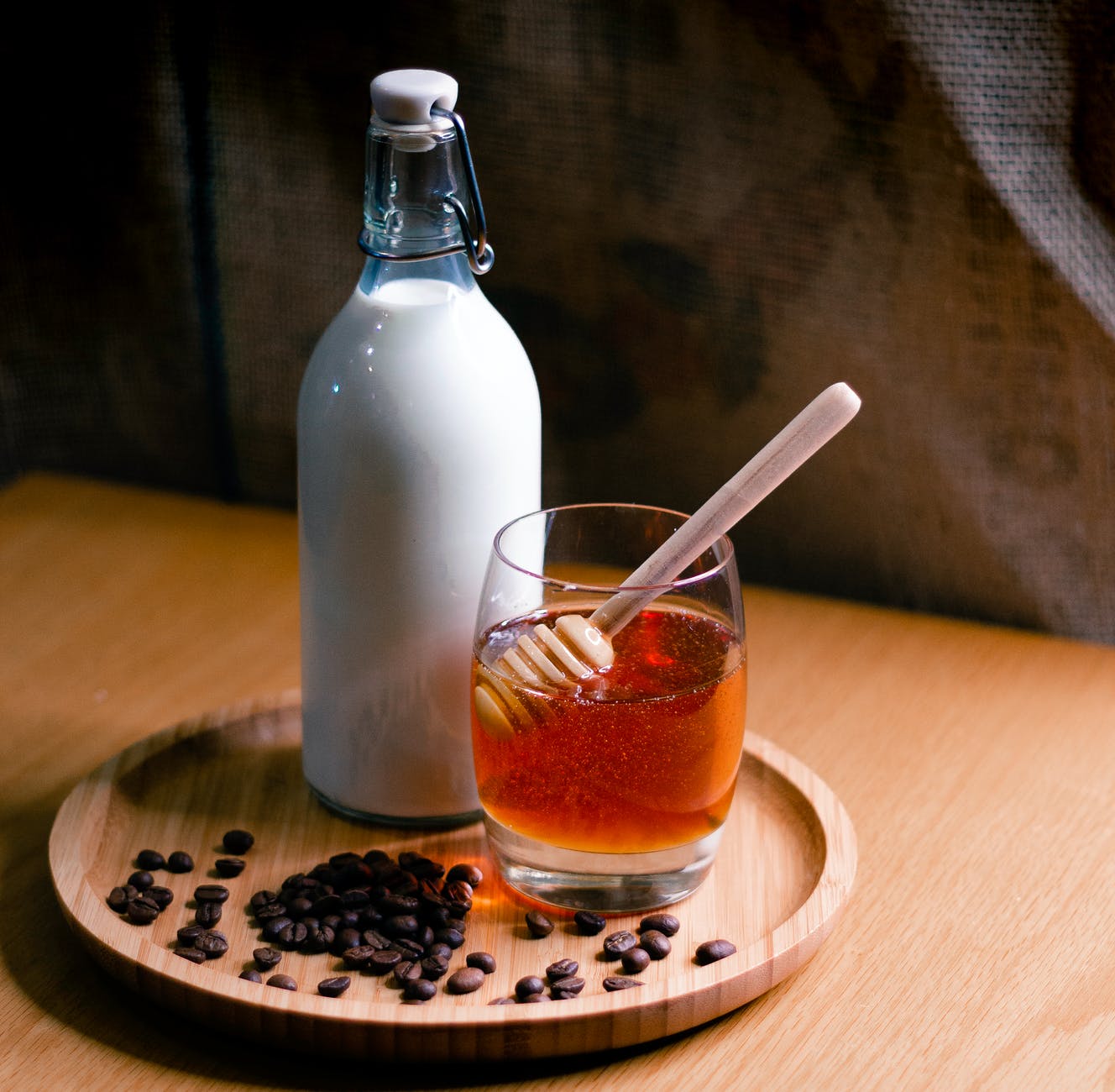 milk and honey on wooden tray
